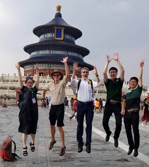 Five students and instructors at a workshop outing to the Temple of Heaven.