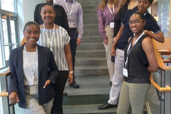 eight students standing on a staircase