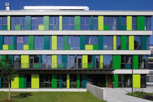 building with glass walls and green walls