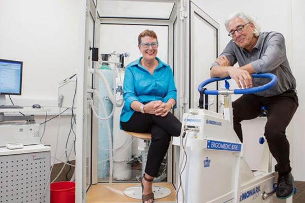 Terrie Moffitt and Avshalom Caspi sitting in lab