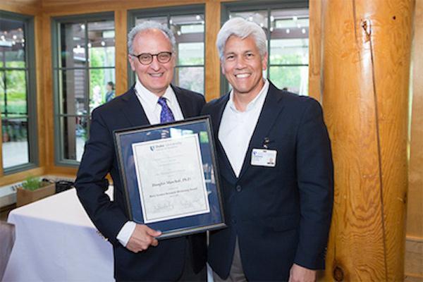 Doug Marchuk, PhD receiving award