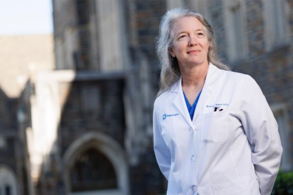 Karen Baker standing in front of Duke buildings
