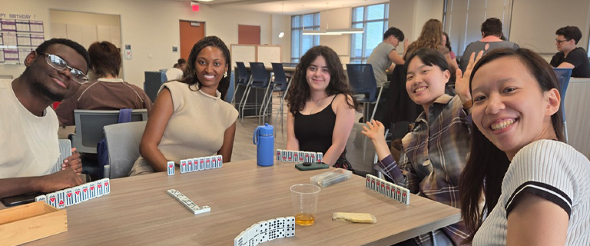 Students playing dominos