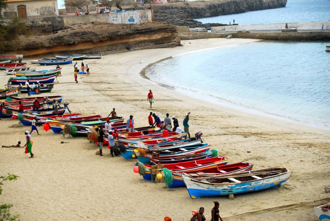 boats and people on beach of Cabo Verde