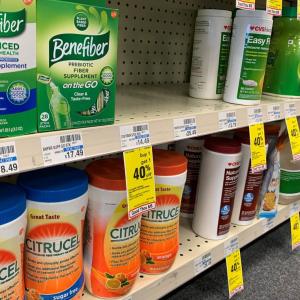 variety of fiber supplement products in a grocery aisle