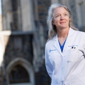 Karen Baker standing in front of Duke buildings
